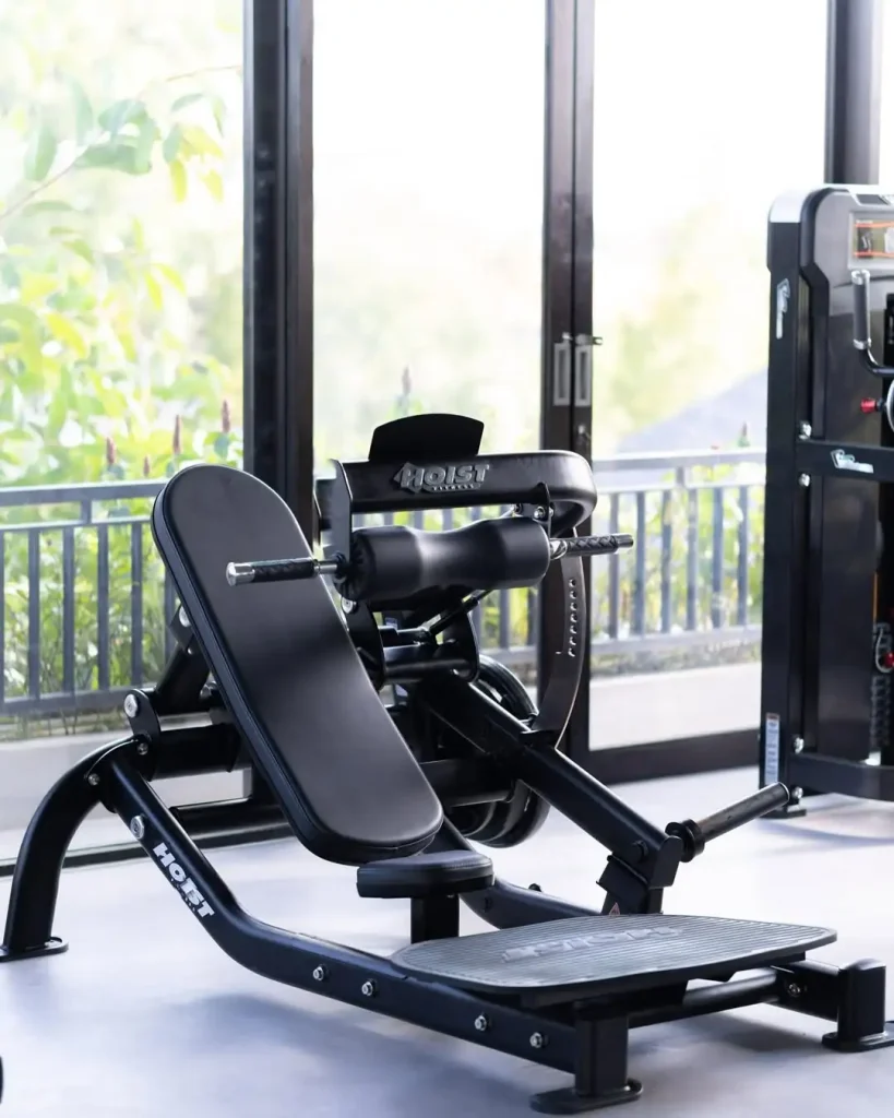 The premium Hoist plate-loaded hip thrust machine at Avenue Fitness in Canggu, positioned near a large window with natural light.